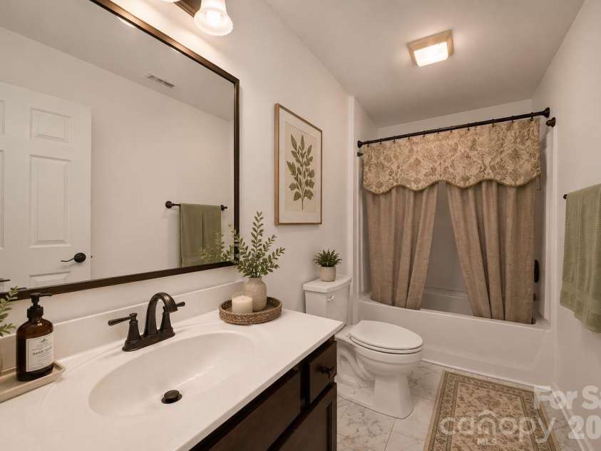 157 Old Harbor Drive, Mount Gilead, NC 27306.  MLS# CAR4375307, YatesRealty ID 21038. Virtually Enhanced downstairs bathroom