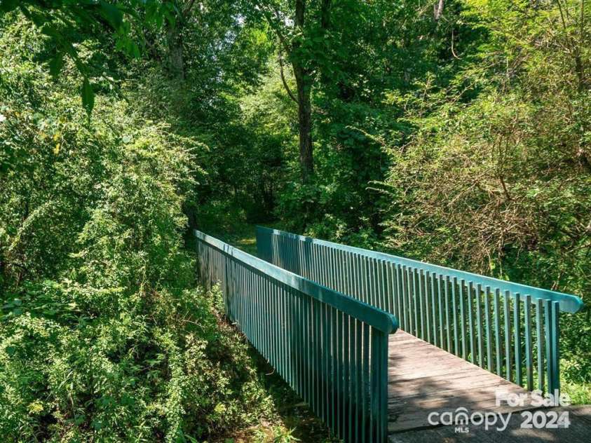 10 Gray Wolf Lane, Hendersonville, NC 28792.  MLS# CAR4267115, YatesRealty ID 21056. Bridge to Walking Trail