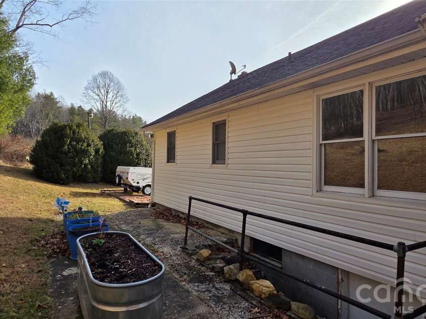 212 Old Dale Road, Spruce Pine, NC 28777.  MLS# CAR4335802, YatesRealty ID 2106. Rear of home