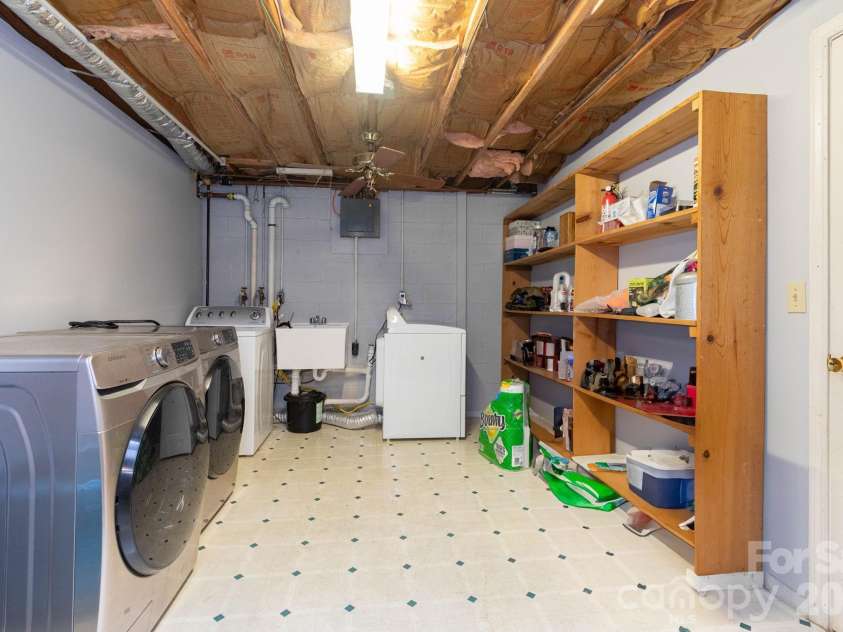936 Toxaway Drive, Hendersonville, NC 28791.  MLS# CAR4399122, YatesRealty ID 2106. Laundry Area with Additional Storage