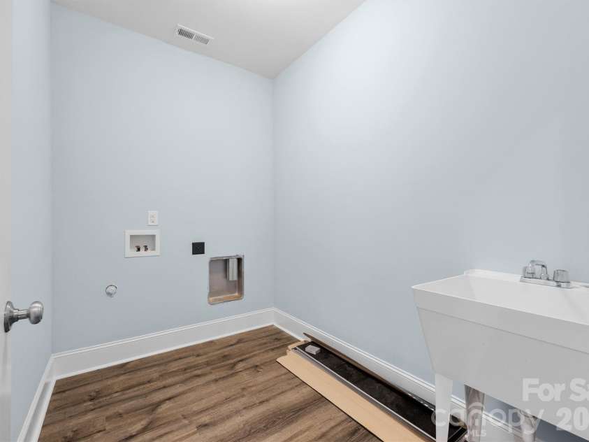 12057 Mariners Cove Court, Lancaster, SC 29720.  MLS# CAR4359140, YatesRealty ID 21066. Laundry room w/ sink
