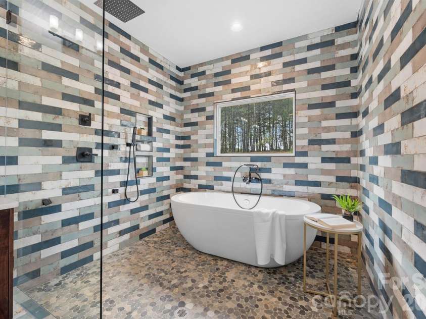 12057 Mariners Cove Court, Lancaster, SC 29720.  MLS# CAR4359140, YatesRealty ID 21066. Spa-like primary bath