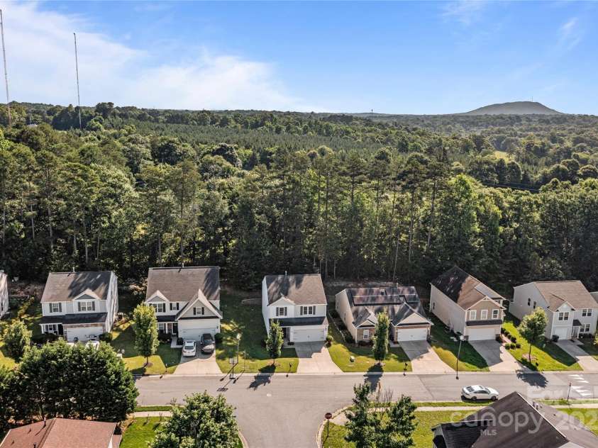 2532 Blue Moss Drive, Dallas, NC 28034.  MLS# CAR4271917, YatesRealty ID 21069. Aerial view of home and Blue Moss Drive.