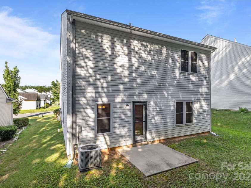 2532 Blue Moss Drive, Dallas, NC 28034.  MLS# CAR4271917, YatesRealty ID 21069. Back view of home.