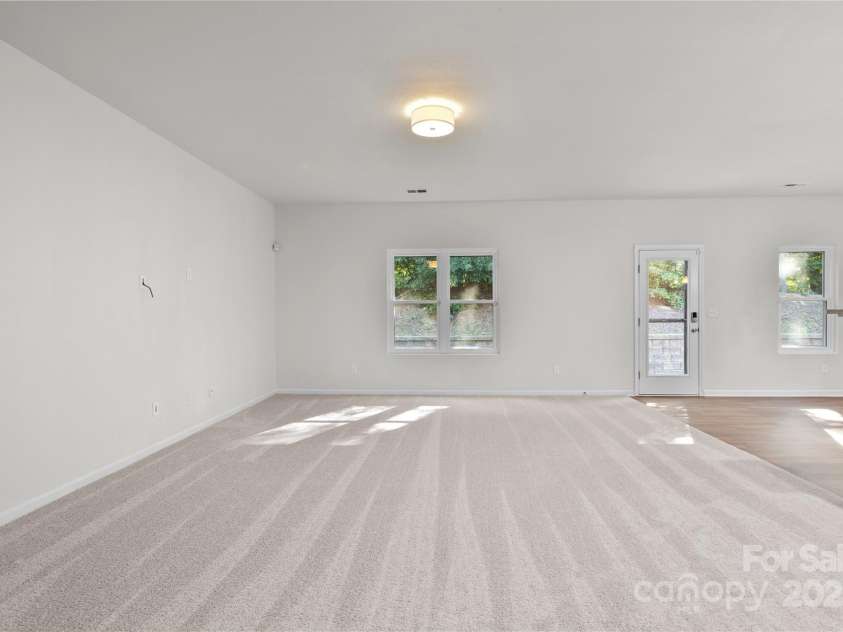 2532 Blue Moss Drive, Dallas, NC 28034.  MLS# CAR4271917, YatesRealty ID 21069. Open concept floor plan provides a seamless flow between the great room, kitchen, and dining area. Freshly painted walls and ceilings, brand new carpet and pad, new ceiling light fixture.