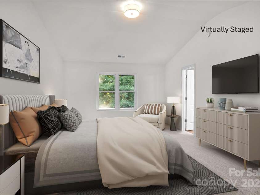 2532 Blue Moss Drive, Dallas, NC 28034.  MLS# CAR4271917, YatesRealty ID 21069. Virtually staged primary bedroom with room for sitting area, larger dressers, end tables.