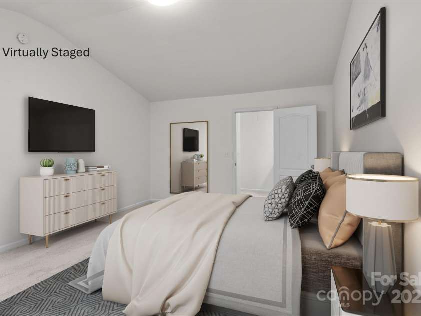 2532 Blue Moss Drive, Dallas, NC 28034.  MLS# CAR4271917, YatesRealty ID 21069. Virtually staged serene and spacious primary bedroom is a true retreat for the homeowners.