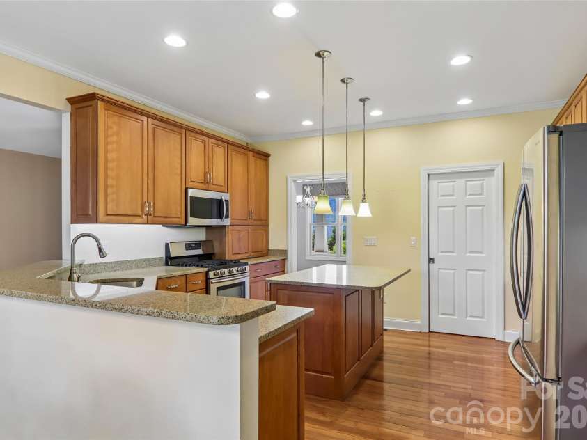 959 Silverglen Way, Hendersonville, NC 28792.  MLS# CAR4397996, YatesRealty ID 21071. Kitchen opens to dining room