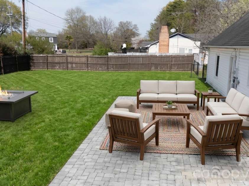 101 Woodland Drive, Clover, SC 29710.  MLS# CAR4357605, YatesRealty ID 21073. Back yard w/ large patio off kitchen (virtually staged
