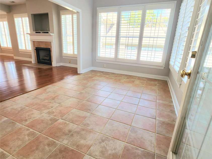18845 Cloverstone Circle, Cornelius, NC 28031.  MLS# CAR4231582, YatesRealty ID 21073. Bright, sunny sunroom off great room