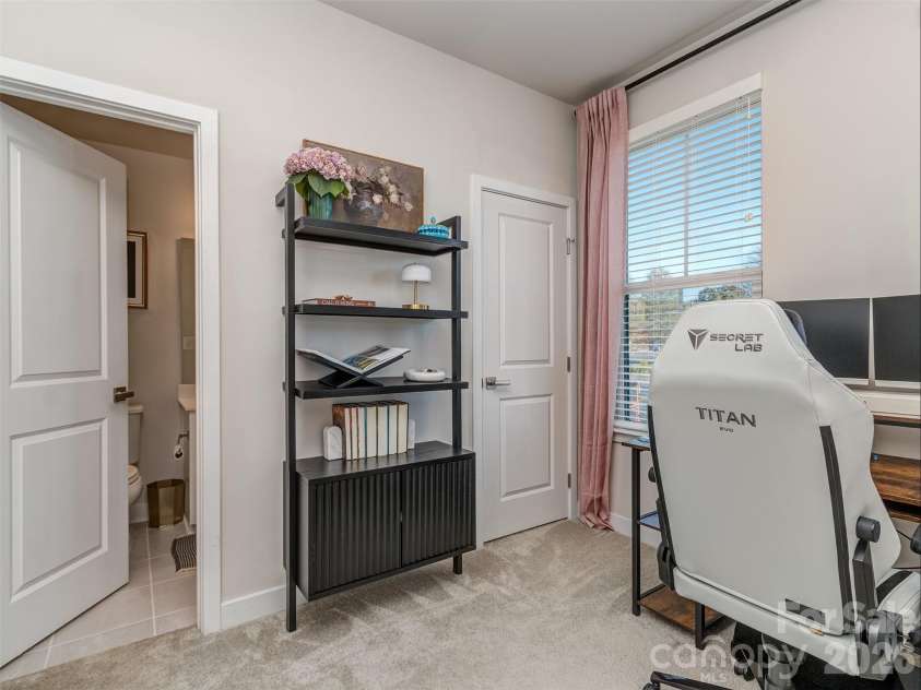 1033 Simcoe Lane, Charlotte, NC 28217.  MLS# CAR4358003, YatesRealty ID 21074. Large Guest Suite with Custom Blinds, Walk-In Closet, and Private Bath!