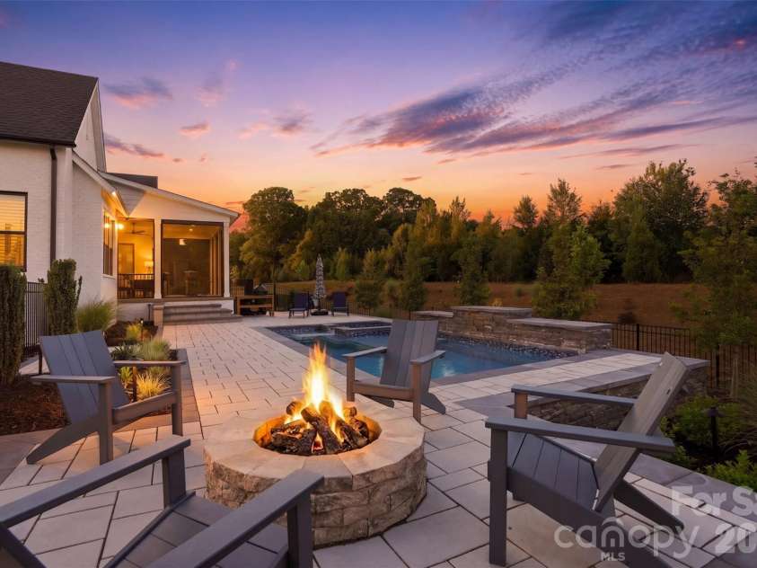 1124 Mesa Way, Marvin, NC 28173.  MLS# CAR4371986, YatesRealty ID 21082. Perfect backyard for entertaining with pool and firepit
