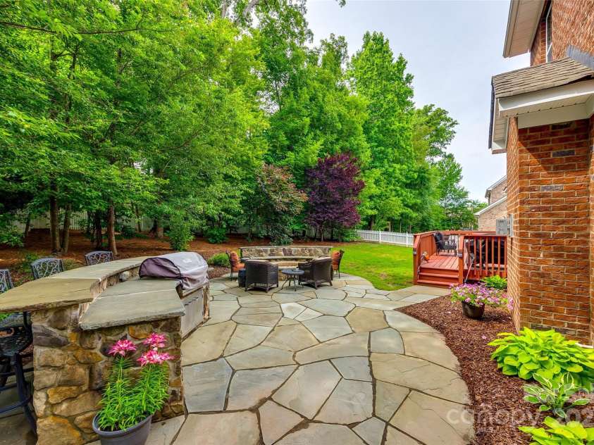 4711 Pearmain Drive, Waxhaw, NC 28173.  MLS# CAR4246425, YatesRealty ID 21087. Custom gas grill and bar area