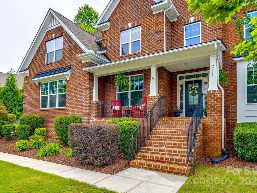 4711 Pearmain Drive, Waxhaw, NC 28173.  MLS# CAR4246425, YatesRealty ID 21087. Rocking chair front porch