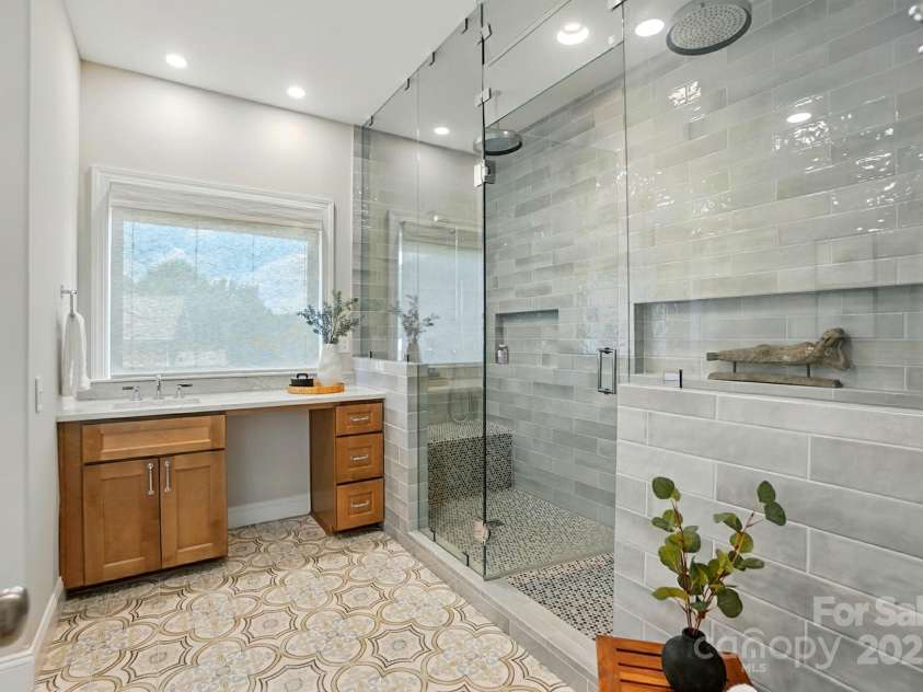 7903 Tottenham Court, Waxhaw, NC 28173.  MLS# CAR4270692, YatesRealty ID 21096. Incredible shower spans the length of the bathroom