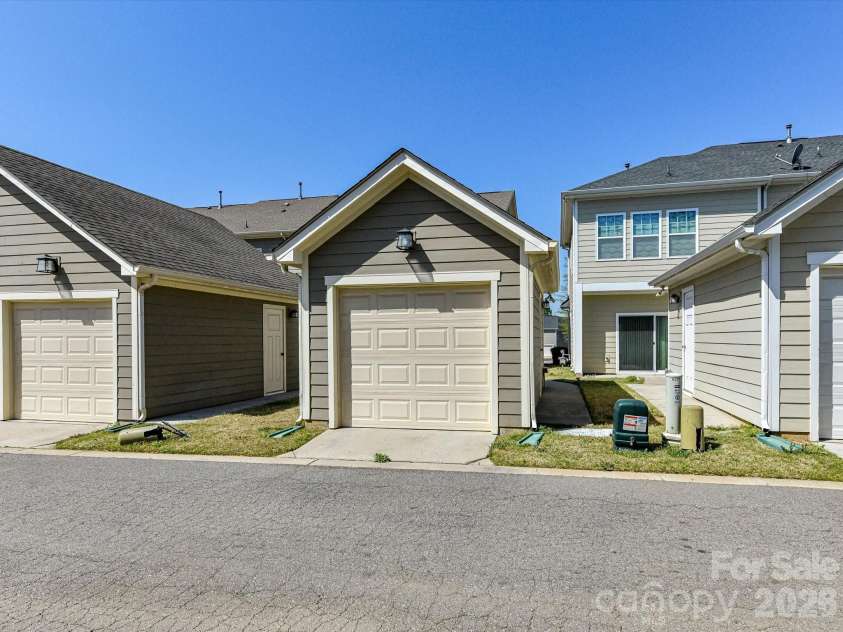 2718 Tranquil Oak Place, Charlotte, NC 28206.  MLS# CAR4362826, YatesRealty ID 21098. Private single-car garage