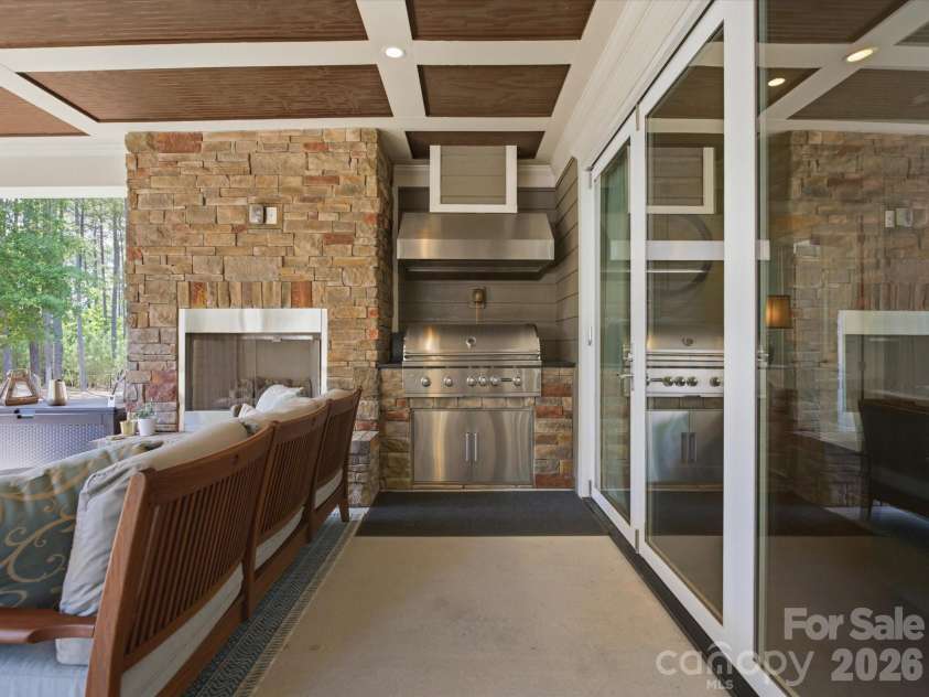 3097 Sherman Drive, Lancaster, SC 29720.  MLS# CAR4366322, YatesRealty ID 21103. Warming up by the outdoor fire