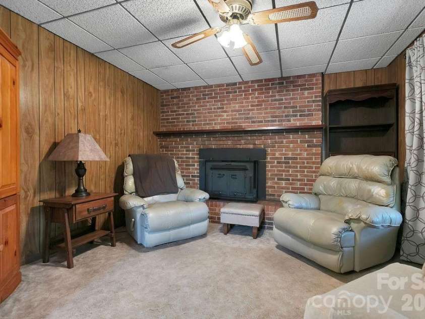 520 Blythe Road, Pisgah Forest, NC 28768.  MLS# CAR4370794, YatesRealty ID 21111. Den with Fireplace