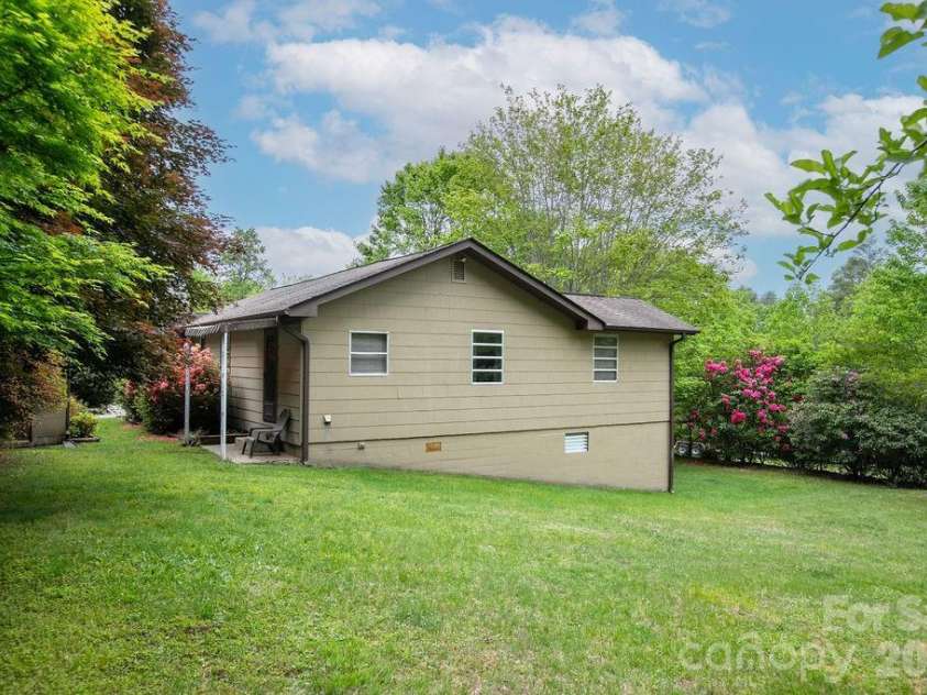 520 Blythe Road, Pisgah Forest, NC 28768.  MLS# CAR4370794, YatesRealty ID 21111. Side Yard