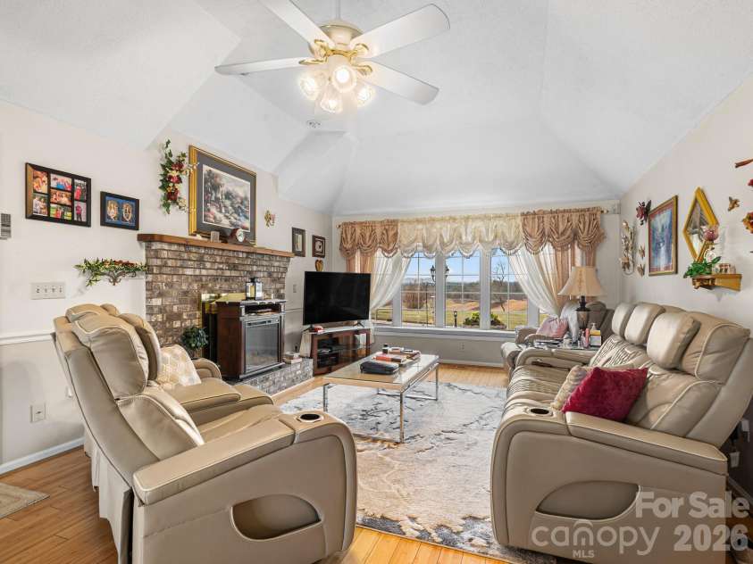 727 Jenkins Valley Road, Alexander, NC 28701.  MLS# CAR4357039, YatesRealty ID 21116. Cozy den with gas log FP