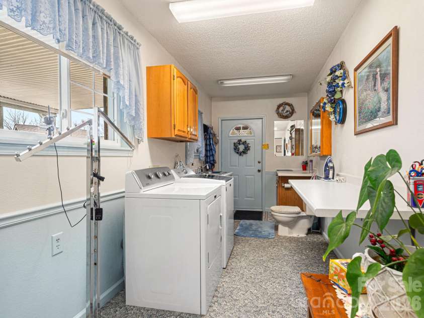 727 Jenkins Valley Road, Alexander, NC 28701.  MLS# CAR4357039, YatesRealty ID 21116. Laundry/mudroom with a quick relief station!