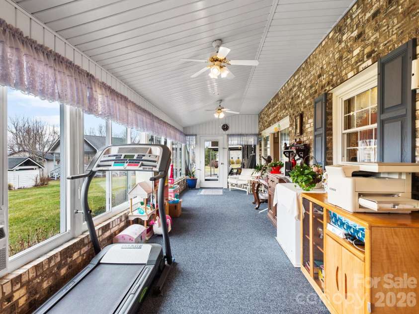 727 Jenkins Valley Road, Alexander, NC 28701.  MLS# CAR4357039, YatesRealty ID 21116. Spacious sunroom.