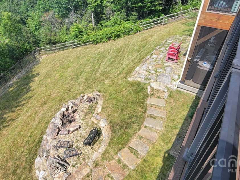 2839 Catawba Falls Parkway, Black Mountain, NC 28711.  MLS# CAR4273331, YatesRealty ID 21124. Back Yard and Fire Pit