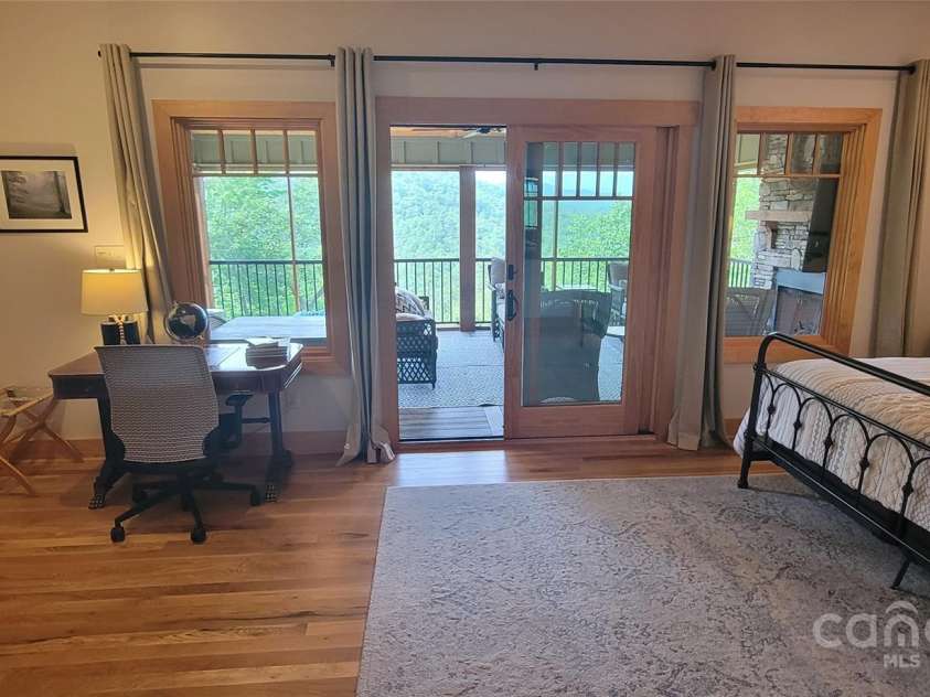 2839 Catawba Falls Parkway, Black Mountain, NC 28711.  MLS# CAR4273331, YatesRealty ID 21124. Primary BR looking out to screened porch
