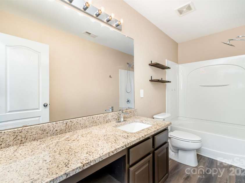 11109 Amur Court, Charlotte, NC 28262.  MLS# CAR4254814, YatesRealty ID 21128. Guest Bathroom