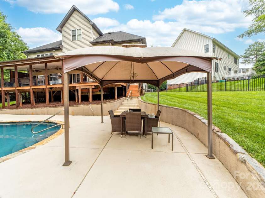 12002 Cobham Court, Huntersville, NC 28078.  MLS# CAR4269076, YatesRealty ID 21134. Covered area for shade by the pool