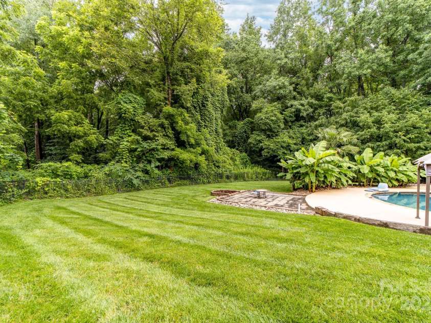 12002 Cobham Court, Huntersville, NC 28078.  MLS# CAR4269076, YatesRealty ID 21134. Even with the pool, there is a lot of grass area