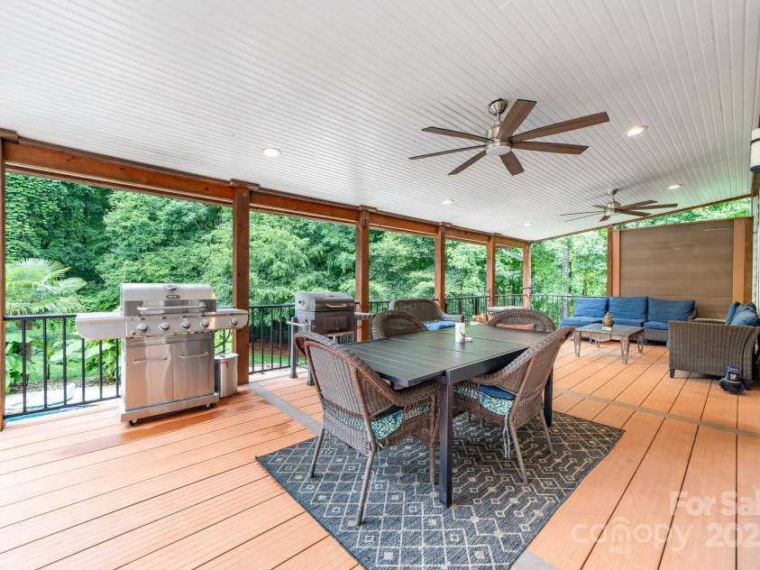12002 Cobham Court, Huntersville, NC 28078.  MLS# CAR4269076, YatesRealty ID 21134. Exceptional extended covered deck overlooking the pool