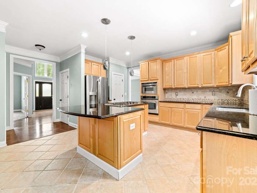 12002 Cobham Court, Huntersville, NC 28078.  MLS# CAR4269076, YatesRealty ID 21134. Kitchen view looking toward the front entry way