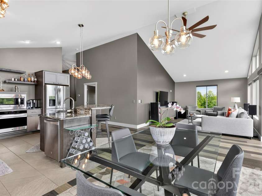 141 Round Top Circle, Mills River, NC 28759.  MLS# CAR4379751, YatesRealty ID 21136. Designed for modern living, the main level offers an open layout connecting the kitchen, dining area, and living space.
