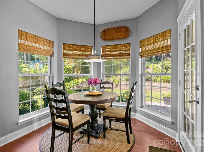 8700 Fox Tail Lane, Huntersville, NC 28078.  MLS# CAR4269110, YatesRealty ID 21136. Enjoy casual dining in the bright and airy breakfast room. A beautiful bay window fills the space w/natural light and offers a lovely view of the backyard gardens.