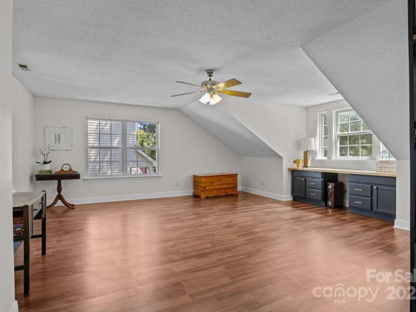 8700 Fox Tail Lane, Huntersville, NC 28078.  MLS# CAR4269110, YatesRealty ID 21136. Large bonus room offering incredible flexibility to suit your lifestyle - perfect for a home office, media room, playroom or guest space.