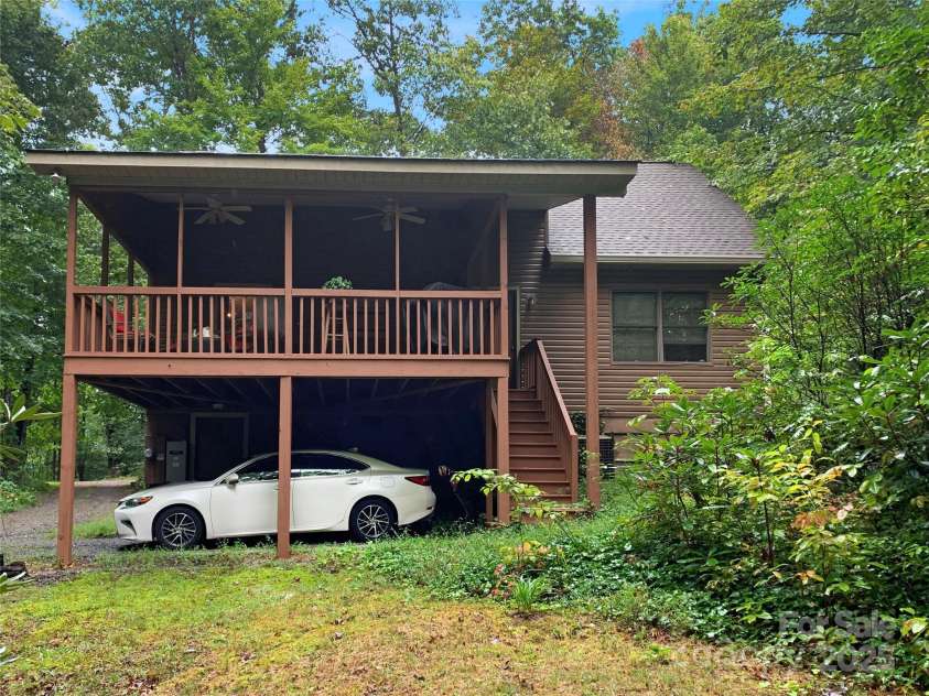 144 Panther Gap Road, Brevard, NC 28712.  MLS# CAR4240689, YatesRealty ID 21141. Parking area below porch