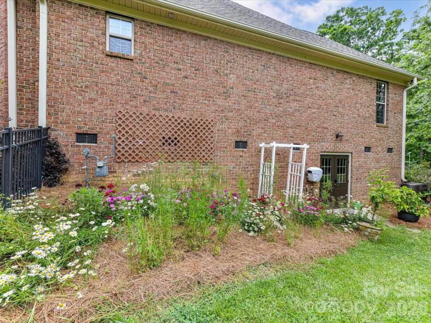 2007 Sugar Mill Road, Indian Trail, NC 28079.  MLS# CAR4375322, YatesRealty ID 21143. Side yard