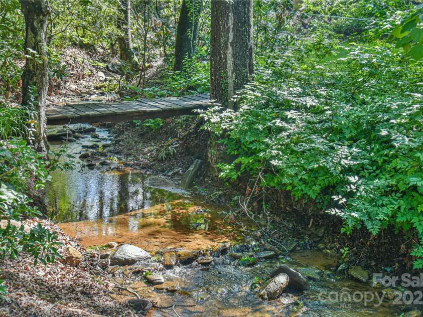 5 Old Cove Road, Black Mountain, NC 28711.  MLS# CAR4263653, YatesRealty ID 21143. Bridge Over Tranquil Waters