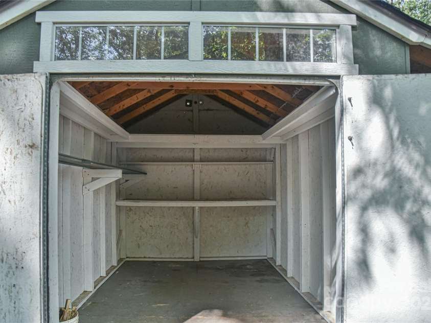 5 Old Cove Road, Black Mountain, NC 28711.  MLS# CAR4263653, YatesRealty ID 21143. Inside View of Woodshed