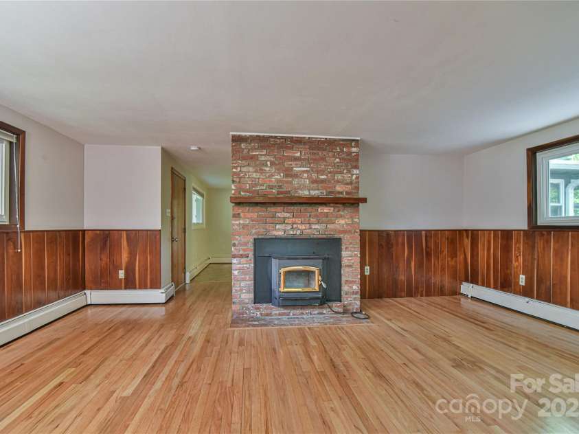 5 Old Cove Road, Black Mountain, NC 28711.  MLS# CAR4263653, YatesRealty ID 21143. Woodstove Insert Heats The Main Floor