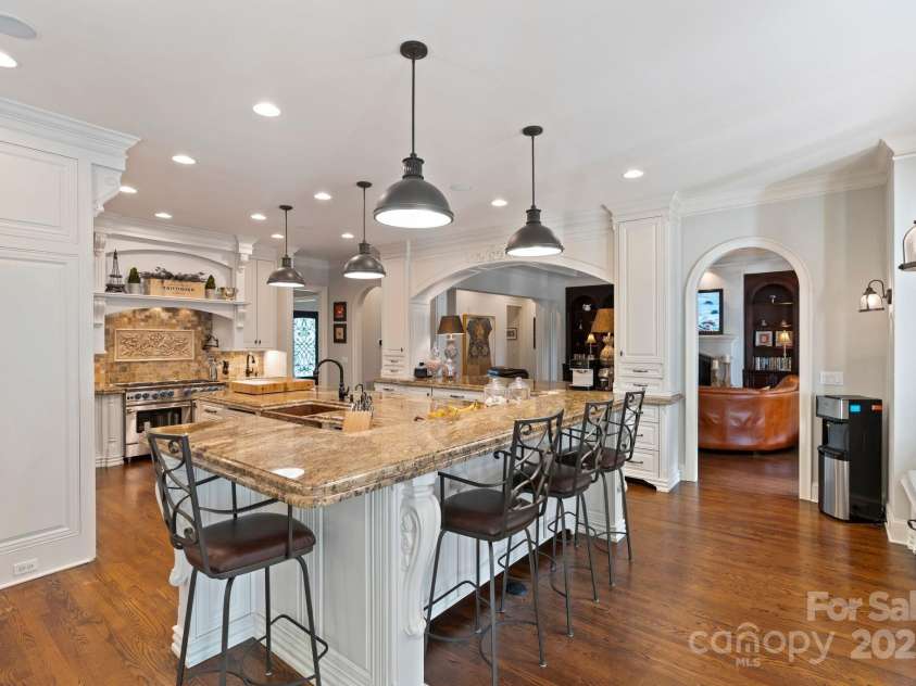 167 Quaker Road, Mooresville, NC 28117.  MLS# CAR4261192, YatesRealty ID 21144. Bar seating offering more space to gather.