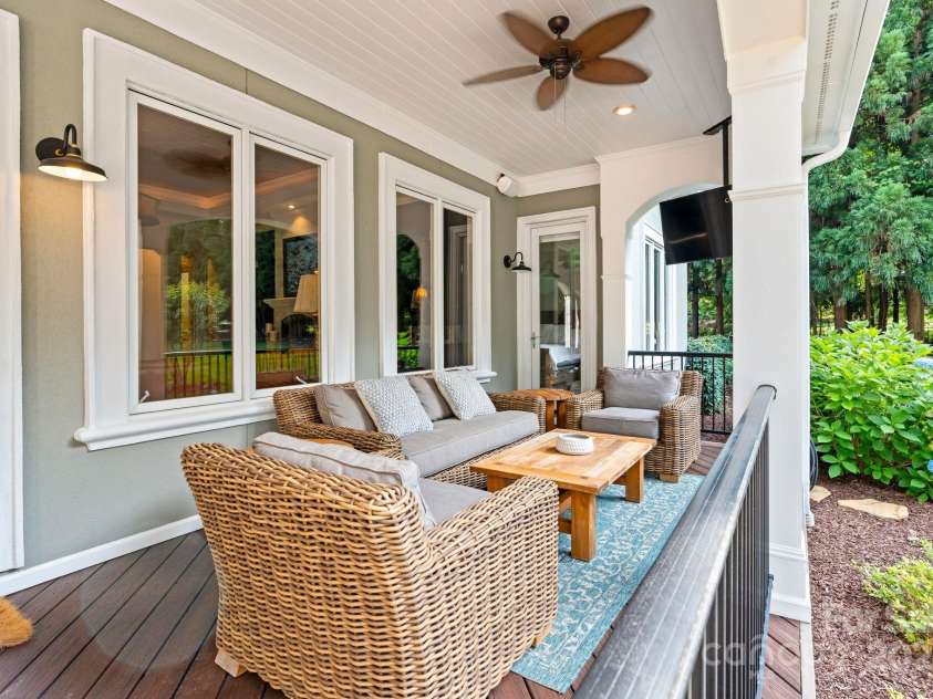 167 Quaker Road, Mooresville, NC 28117.  MLS# CAR4261192, YatesRealty ID 21144. Covered Trex deck leading to expansive patio