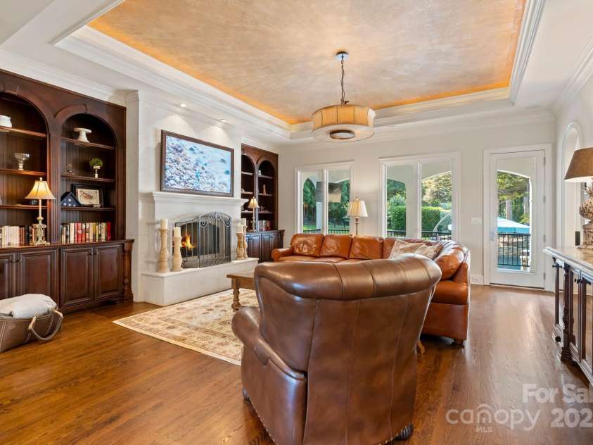 167 Quaker Road, Mooresville, NC 28117.  MLS# CAR4261192, YatesRealty ID 21144. Cozy family room with built ins and gas fireplace.