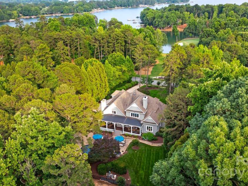 167 Quaker Road, Mooresville, NC 28117.  MLS# CAR4261192, YatesRealty ID 21144. Nestled on 1.21 acres of Lake Norman living.