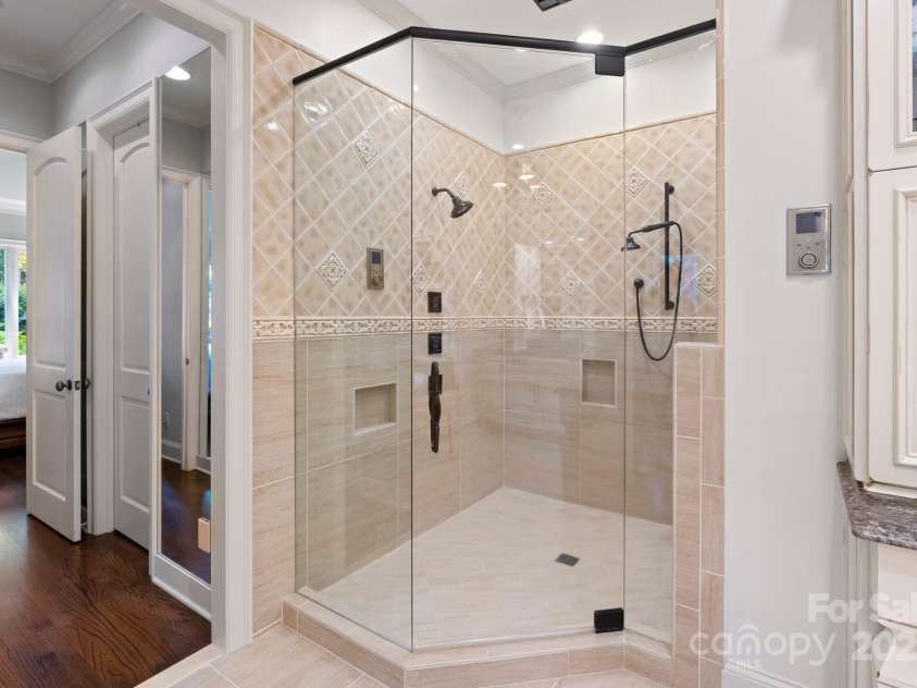 167 Quaker Road, Mooresville, NC 28117.  MLS# CAR4261192, YatesRealty ID 21144. Programable walk-in shower with rain heads