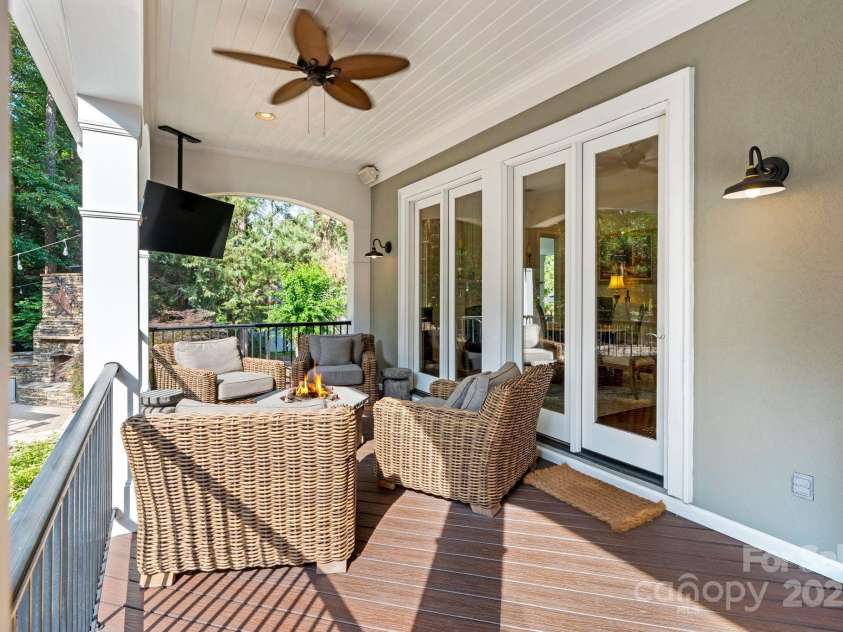 167 Quaker Road, Mooresville, NC 28117.  MLS# CAR4261192, YatesRealty ID 21144. TV, fans, and fire-area provide year-round enjoyment