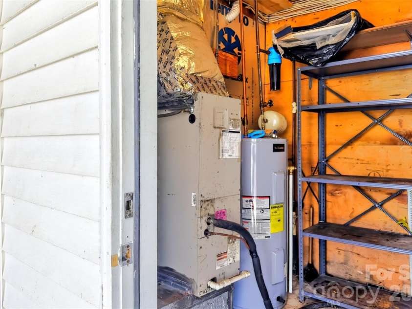 75 Laurelwood Drive, Marion, NC 28752.  MLS# CAR4361973, YatesRealty ID 21144. Outside storage room and mechanical room.