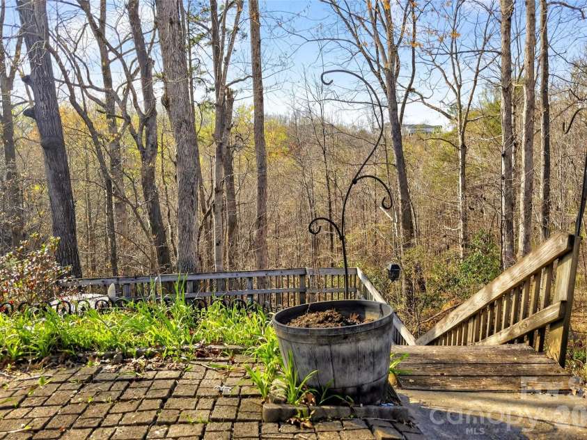 75 Laurelwood Drive, Marion, NC 28752.  MLS# CAR4361973, YatesRealty ID 21144. Patio area and terracing for flowers, etc.