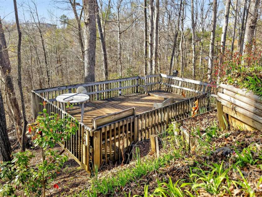 75 Laurelwood Drive, Marion, NC 28752.  MLS# CAR4361973, YatesRealty ID 21144. Private deck area overlooking the woods and filtered mountain views.